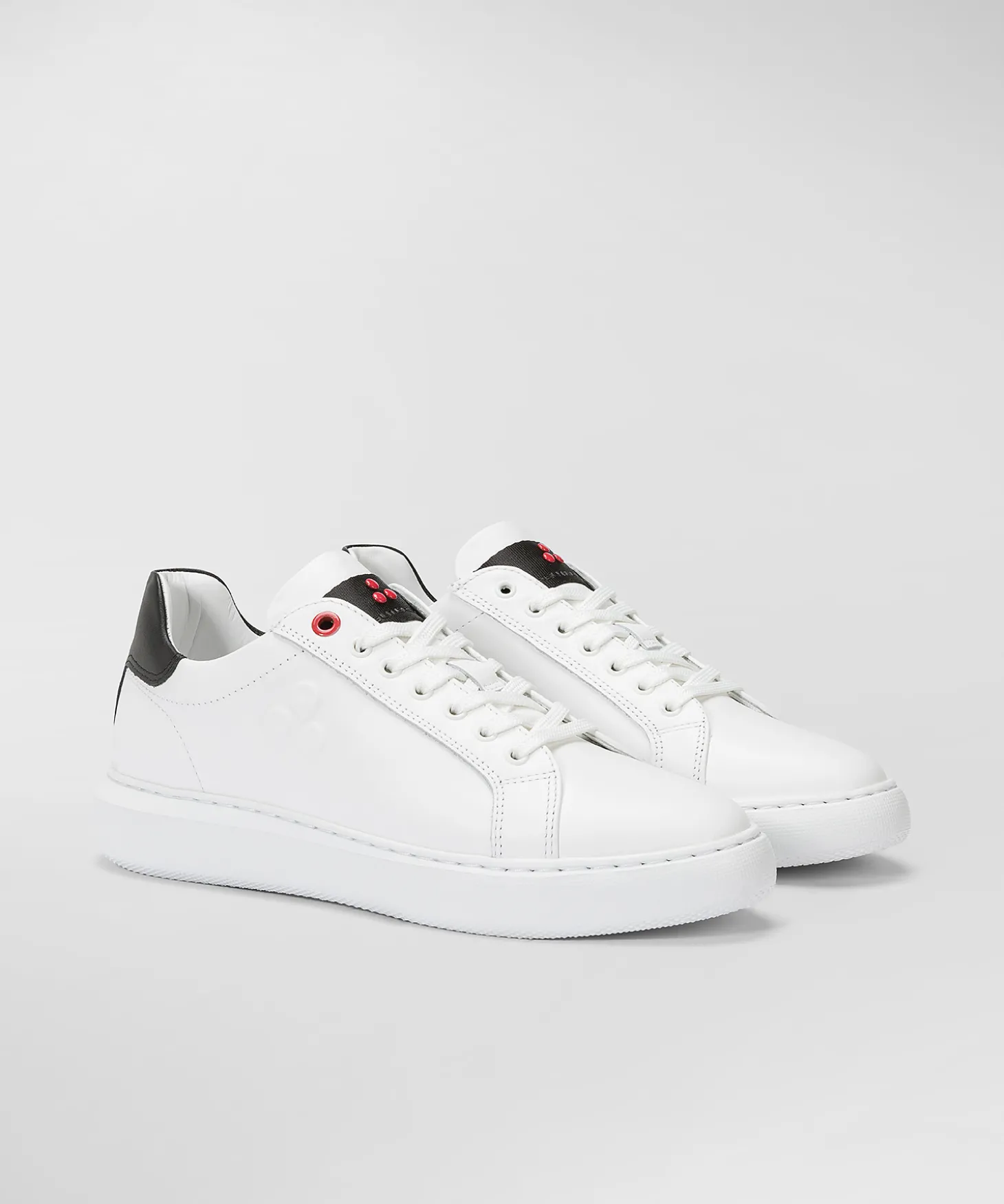 Sneaker In Pelle Con Logo Goffrato